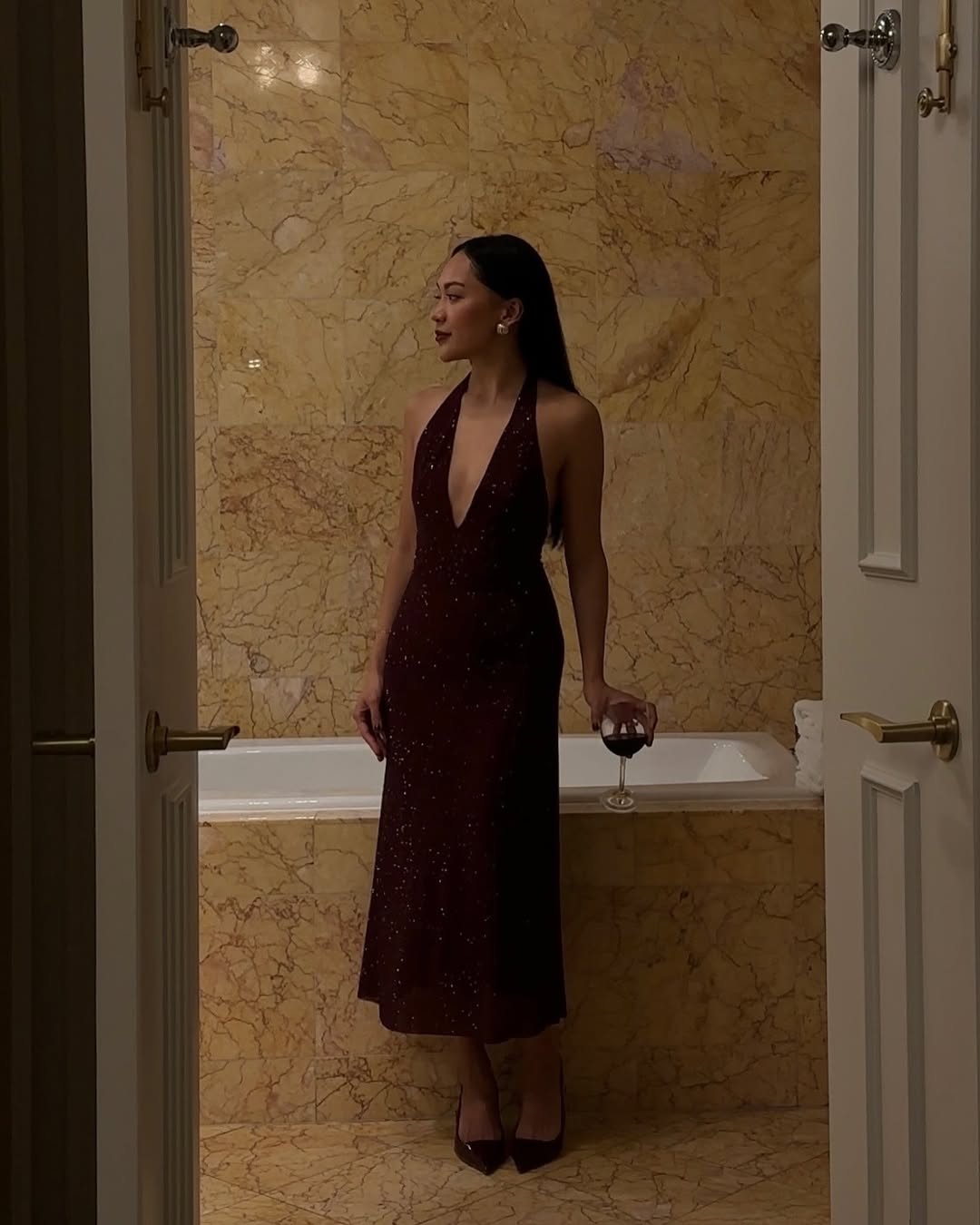 Dawn in a red sparkly halterneck dress