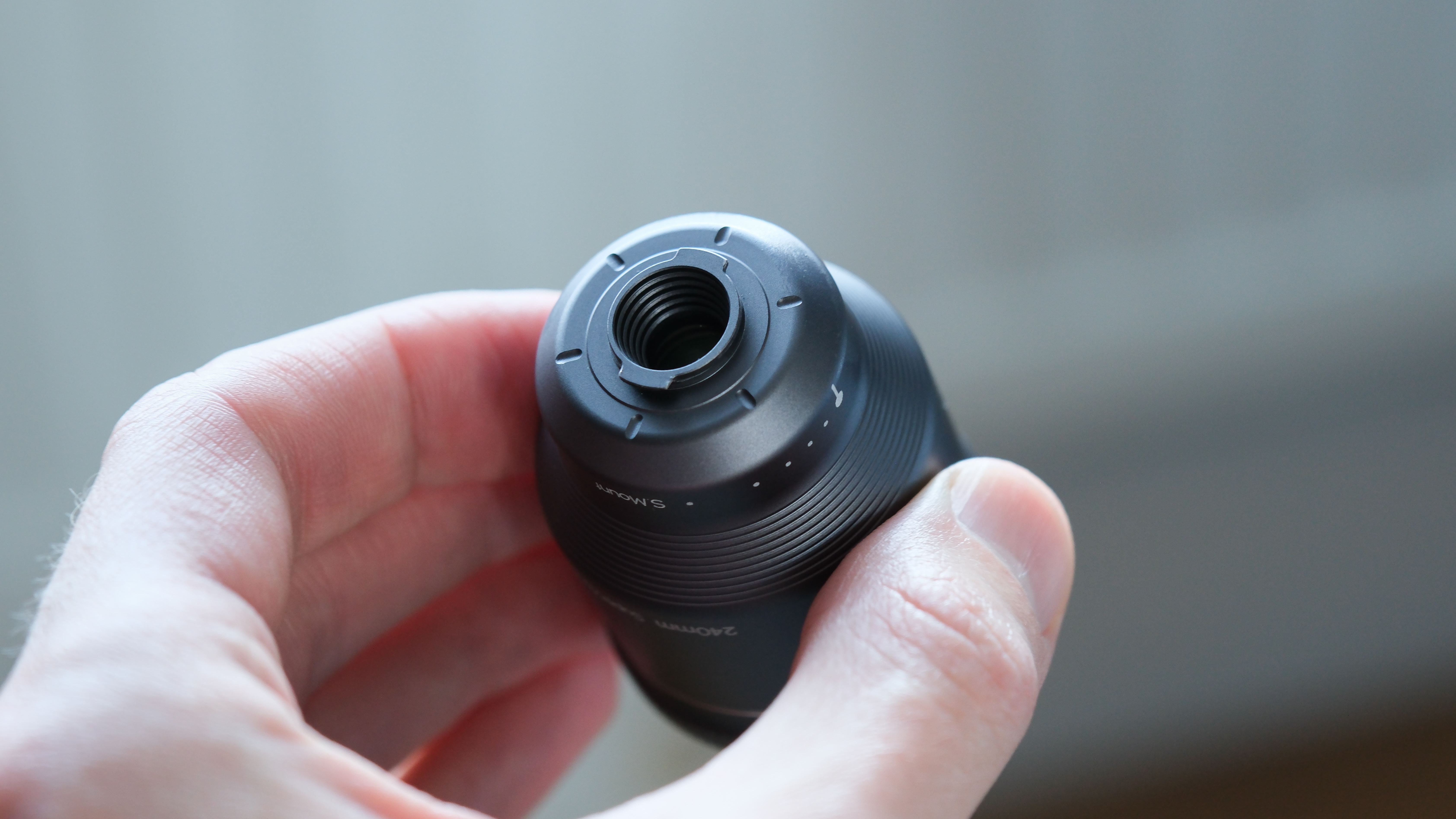 ShiftCam LensUltra Explorer Super Zoom Tele 240mm lens held in a hand