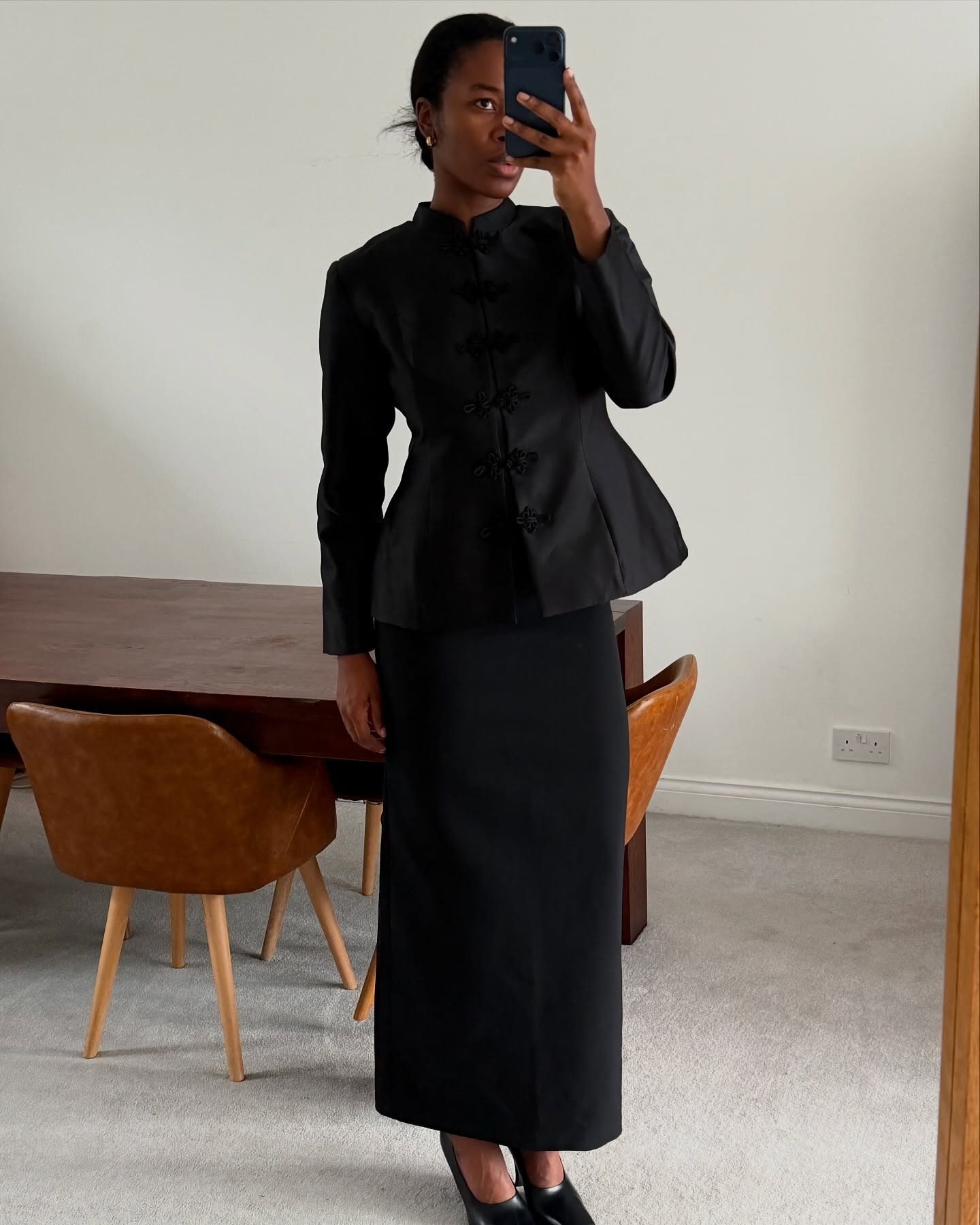 Woman wearing peplum top as a spring 2026 trend.