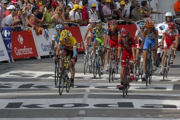 Yellow jersey holder Cadel Evans (BMC) and teammate Mauro Santambrogio cross the finish line, 8:09 down on the Casar group.