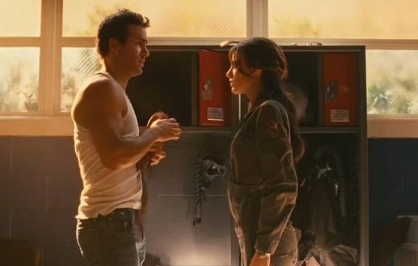 Test pilot Hal Jordan (Ryan Reynolds) gets chewed out by Carol Ferris (Blake Lively) for being late to the job.