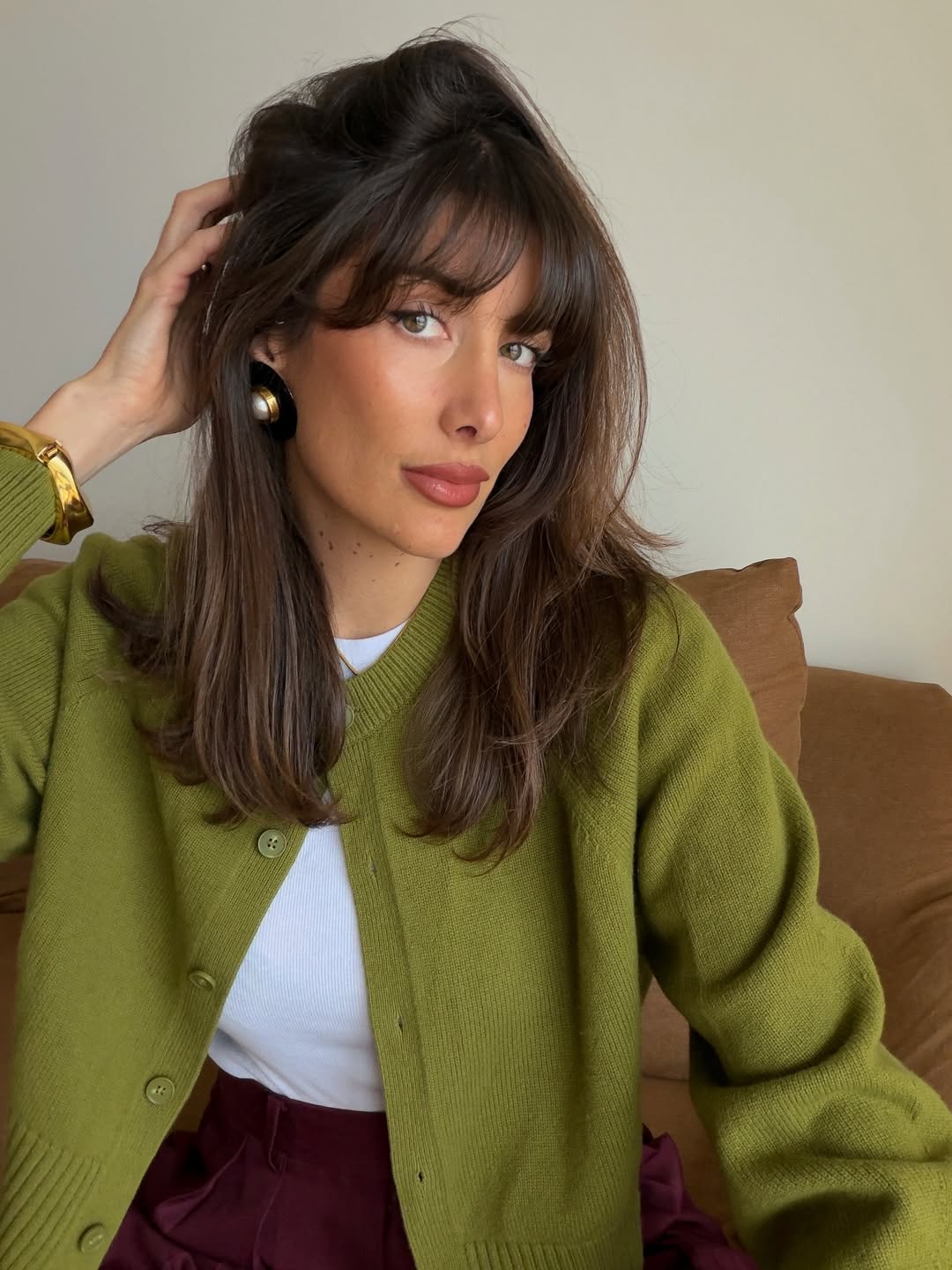 Julie in a green cardigan