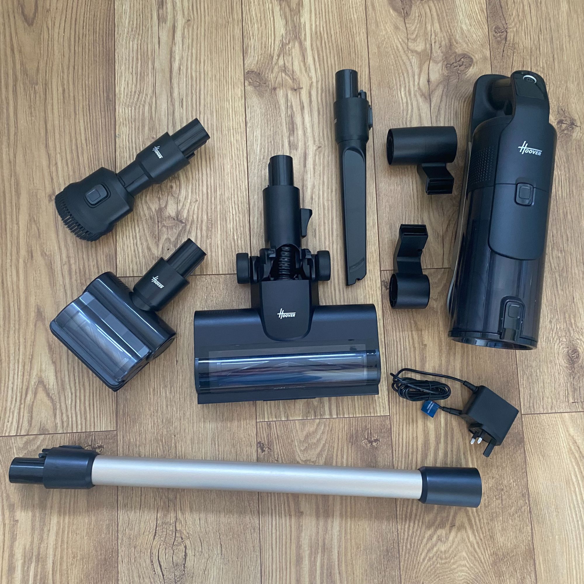 Flat lay of what you get in the box when you buy the Hoover HF6 Turbo Sense Pet cordless vacuum cleaner