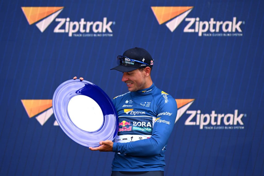 ADELAIDE AUSTRALIA JANUARY 26 Sam Welsford of Australia and Team Red Bull BORA hansgrohe Blue Sprint Jersey celebrates at podium during the 25th Santos Tour Down Under 2025 Stage 6 a 90km stage from Adelaide to Adelaide UCIWT on January 26 2025 in Adelaide Australia Photo by Dario BelingheriGetty Images