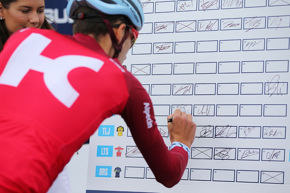A Katusha rider signs on at the Cadel Race