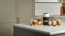 Image of a white Nespresso machine on a kitchen countertop