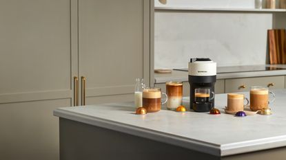 Image of a white Nespresso machine on a kitchen countertop
