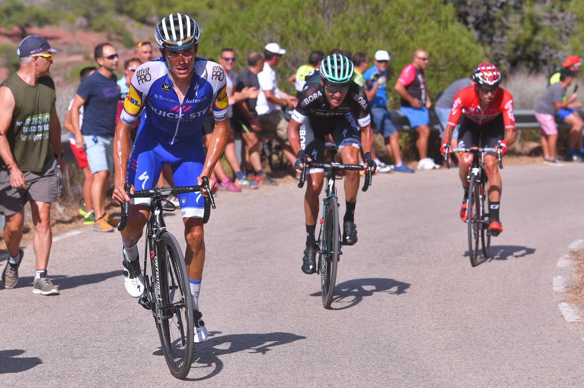 Pawel Poljanski (Bora-Hansgrohe) tries to hold the wheel of Enric Mas