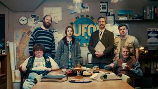 a group of six people posed at a UFO investigating society