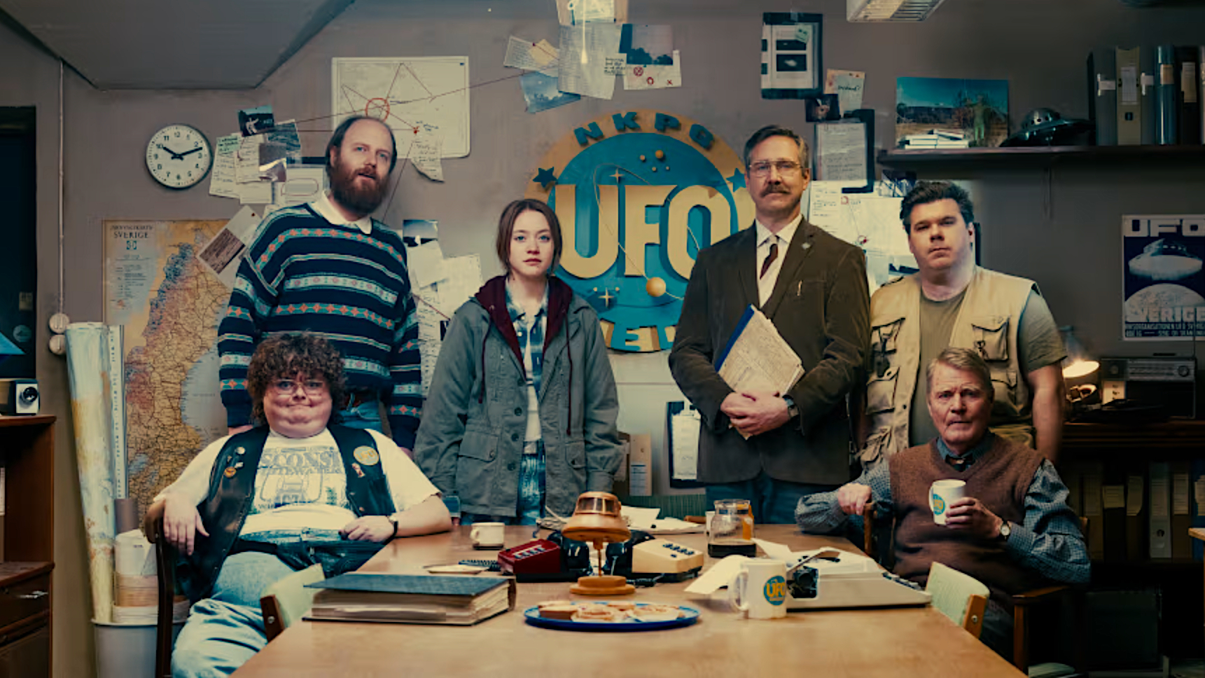 a group of six people posed at a UFO investigating society