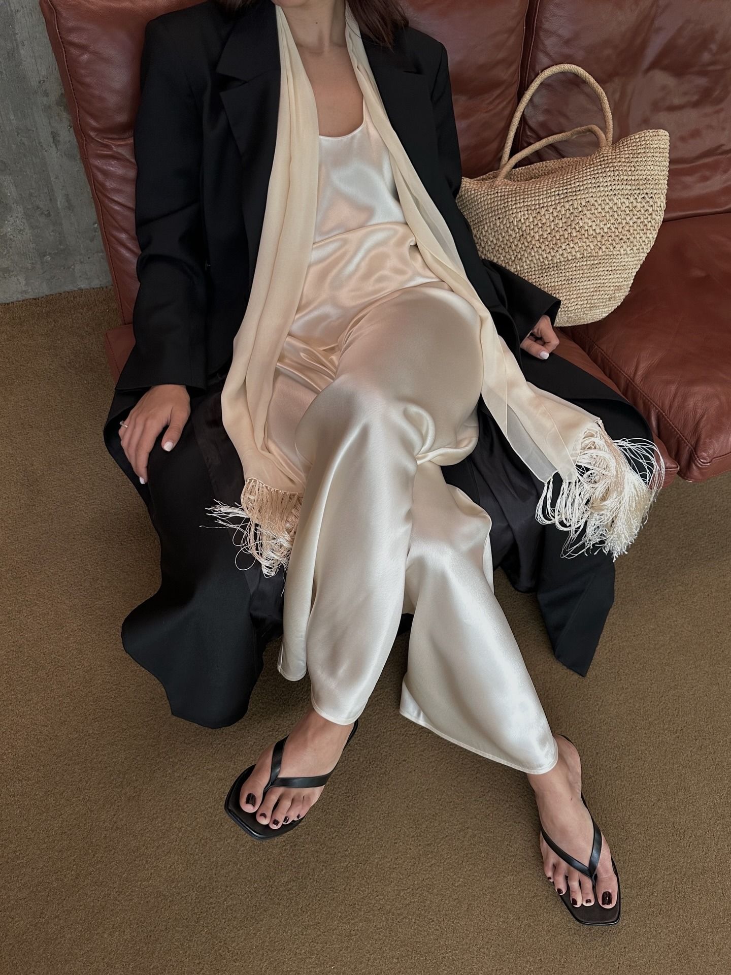 Influencer wearing spring 2026 outfit with silk pants.