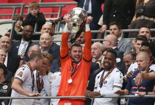 Bromley players celebrate after beating Solihull Moors to win the National League play-off final in May 2024.