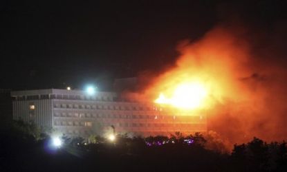 Flames explode and smoke billows upward from the Intercontinental Hotel in Kabul on Wednesday, after an attack by a Taliban suicide squad.