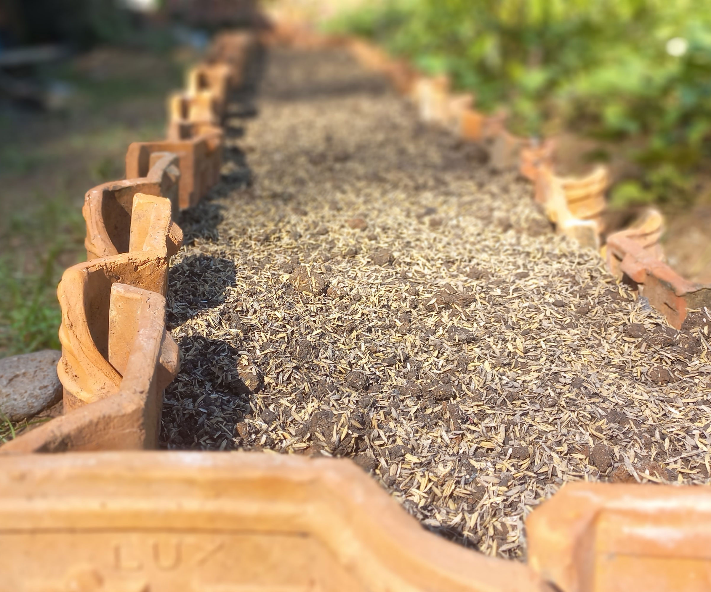 raised beds made from repurposed roof tiles and filled with soil
