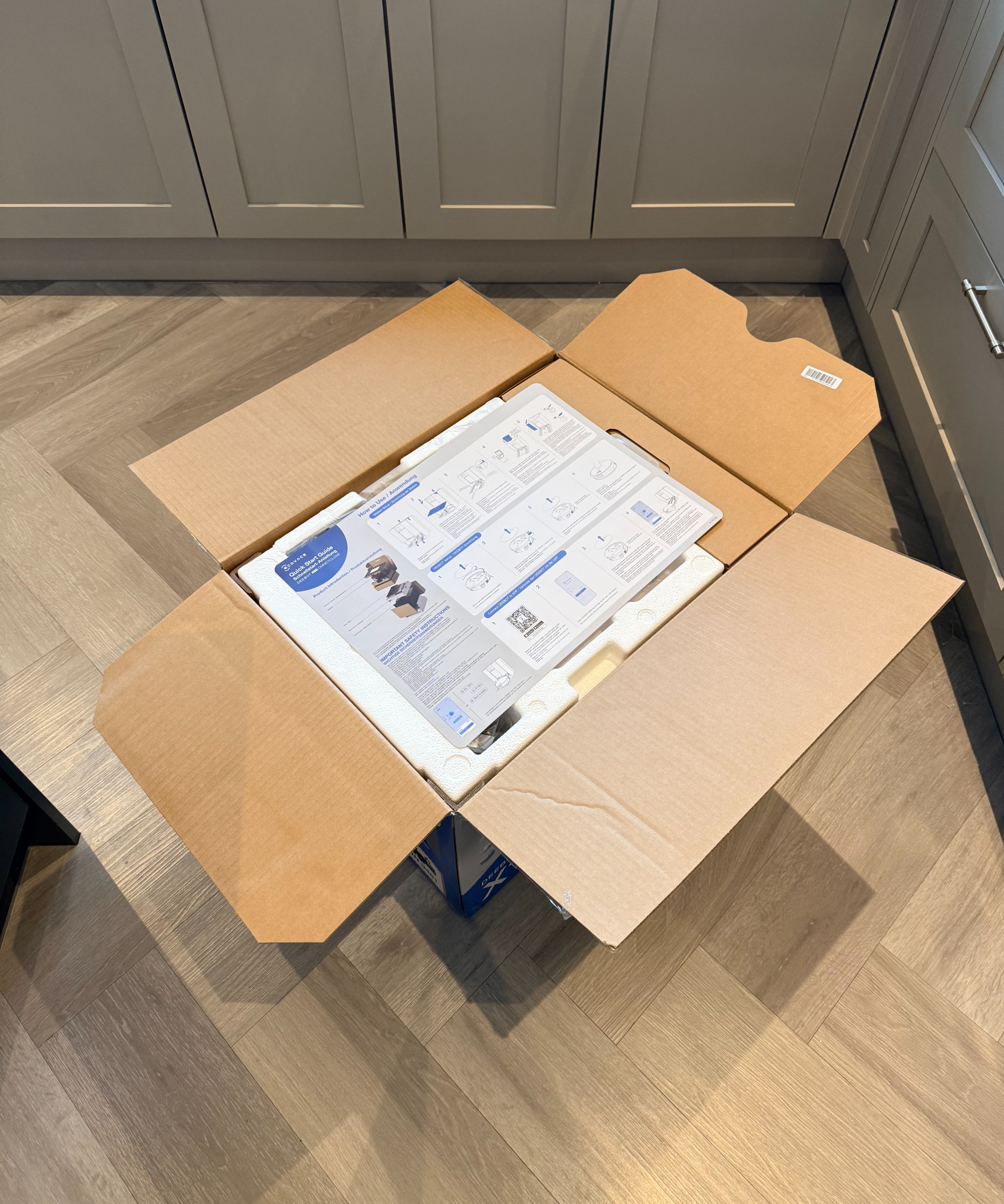 Open ECOVACS DEEBOT X11 OmniCyclone box with setup guide and protective packaging