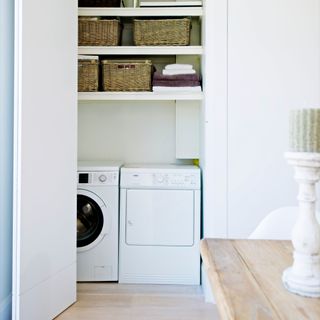 utility room with laundry cupboard