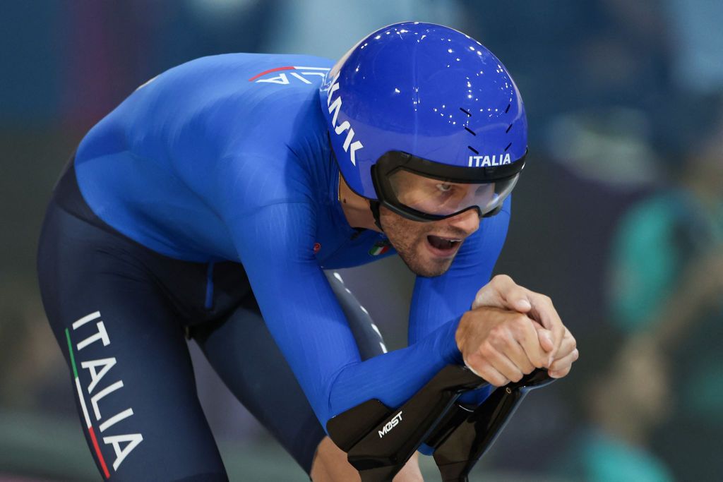 Italy&#039;s Filippo Ganna competes in the men&#039;s track cycling team pursuit final for bronze of the Paris 2024 Olympic Games at the Saint-Quentin-en-Yvelines National Velodrome in Montigny-le-Bretonneux, south-west of Paris, on August 7, 2024. (Photo by Thomas SAMSON / AFP)