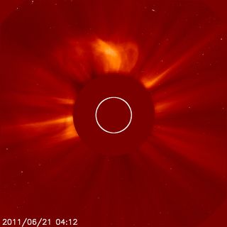 The SOHO sun observatory caught this view of a large solar flare and coronal mass ejection (top of sun) erupting from the sun's surface early June, 21, 2011.
