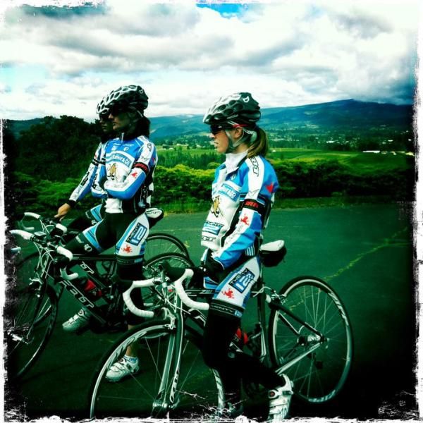 Alisha Welsh and Kaitie Antonneau listen to Kristin Armstrong after preriding the prologue course