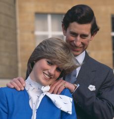 Prince Charles putting his hands on Princess Diana's shoulders during their engagement photoshoot in 1981