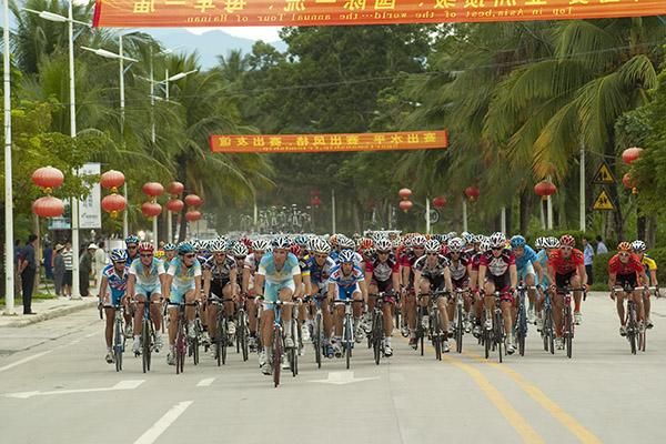 The peloton cruises down the open roads in China during stage two from Sanya to Wuzhishan.