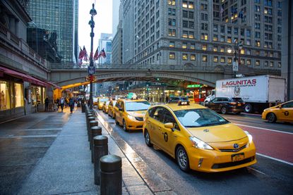 Taxis wait outside Grand Central Terminal in Manhattan