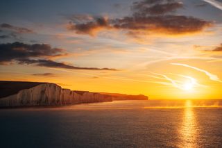 the Seven Sisters cliffs by Benjamin Davies, with the sunshine to the right