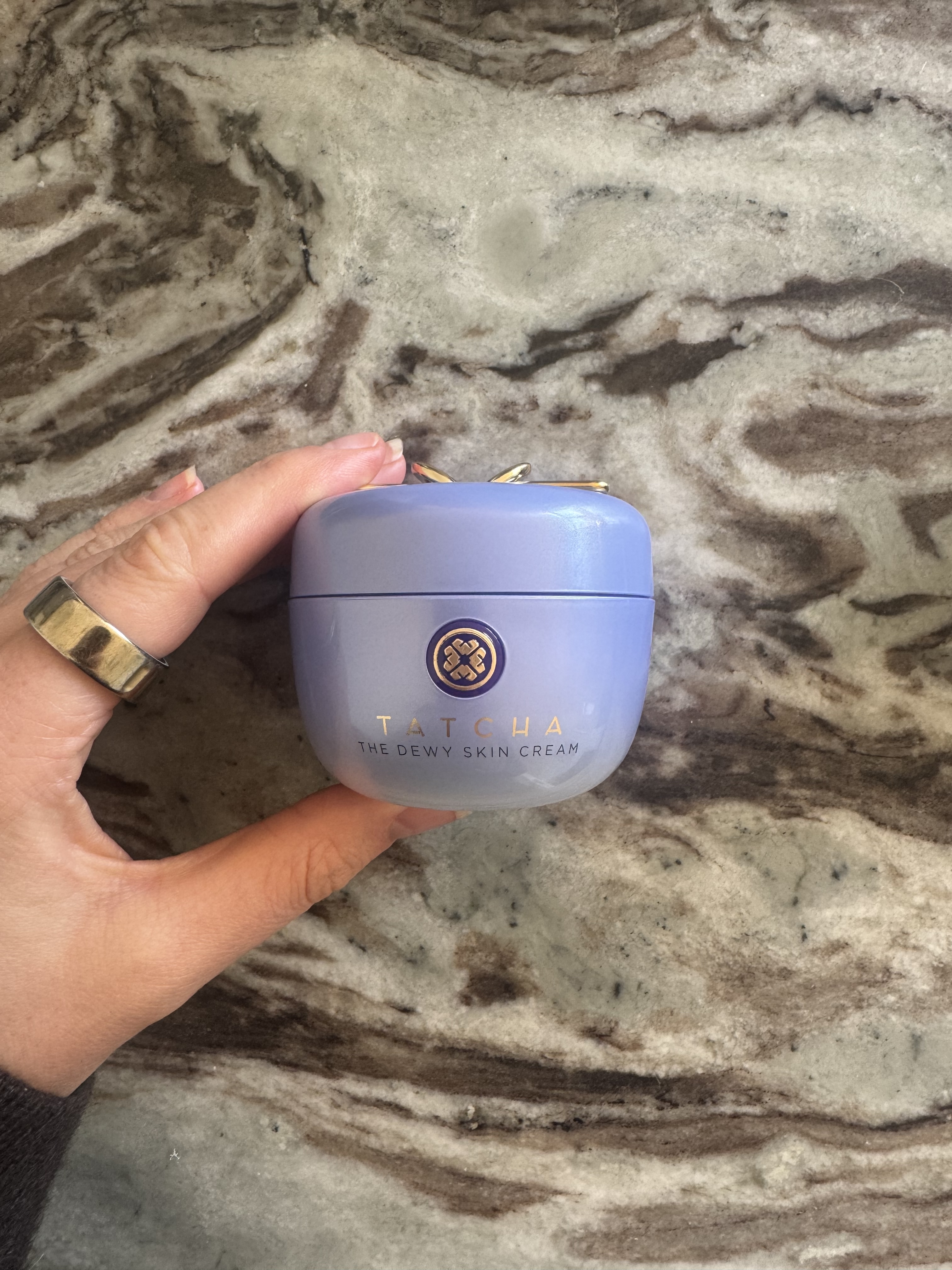 Eleanor holding the Tatcha The Dewy Skin Cream