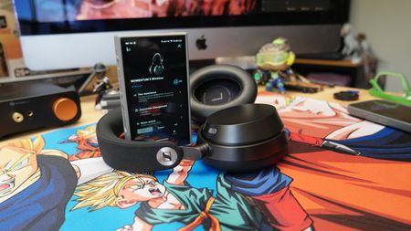 Sennheiser Momentum 5 headphones on a desk with a FiiO M21 DAP