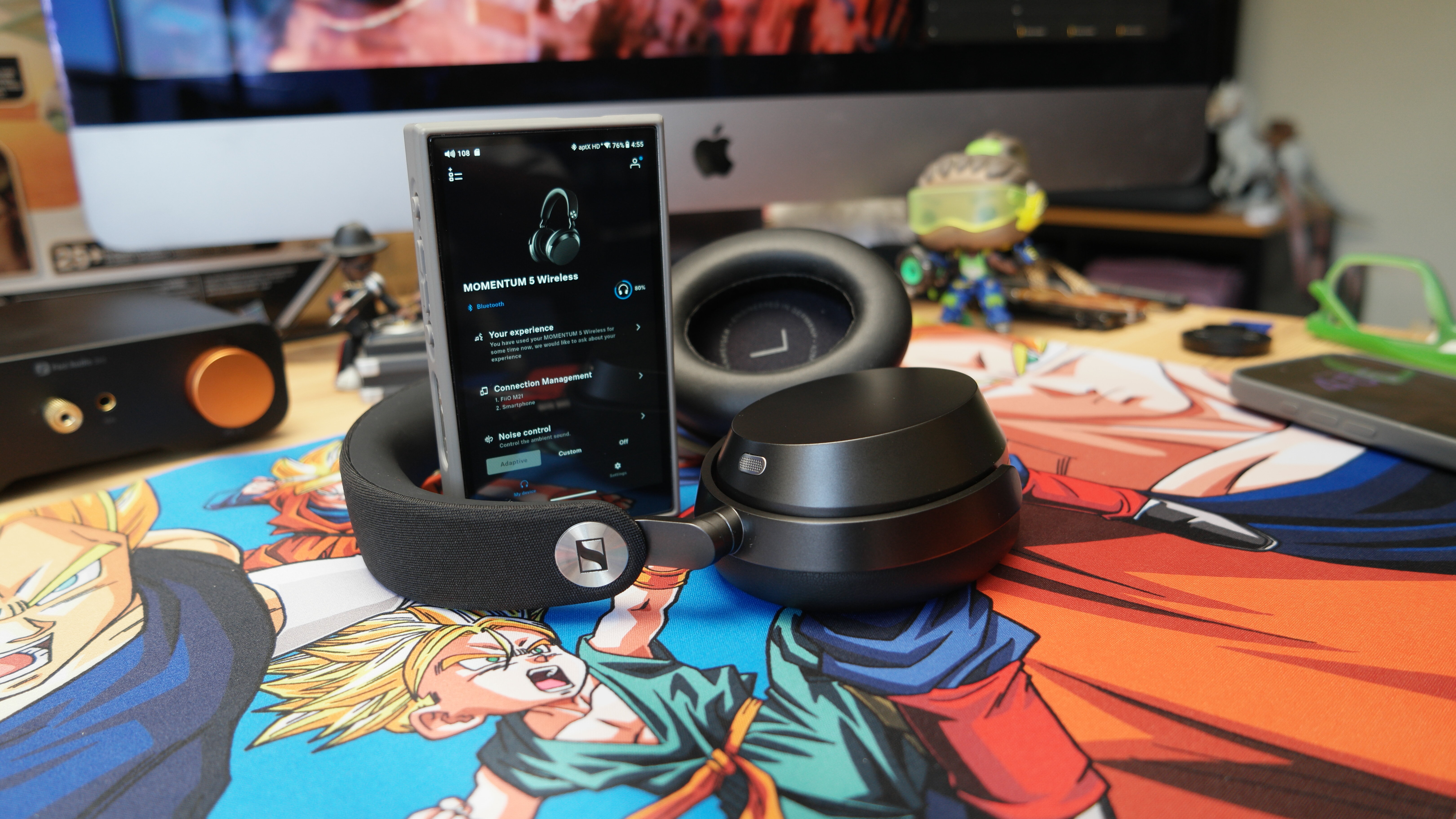 Sennheiser Momentum 5 headphones on a desk with a FiiO M21 DAP