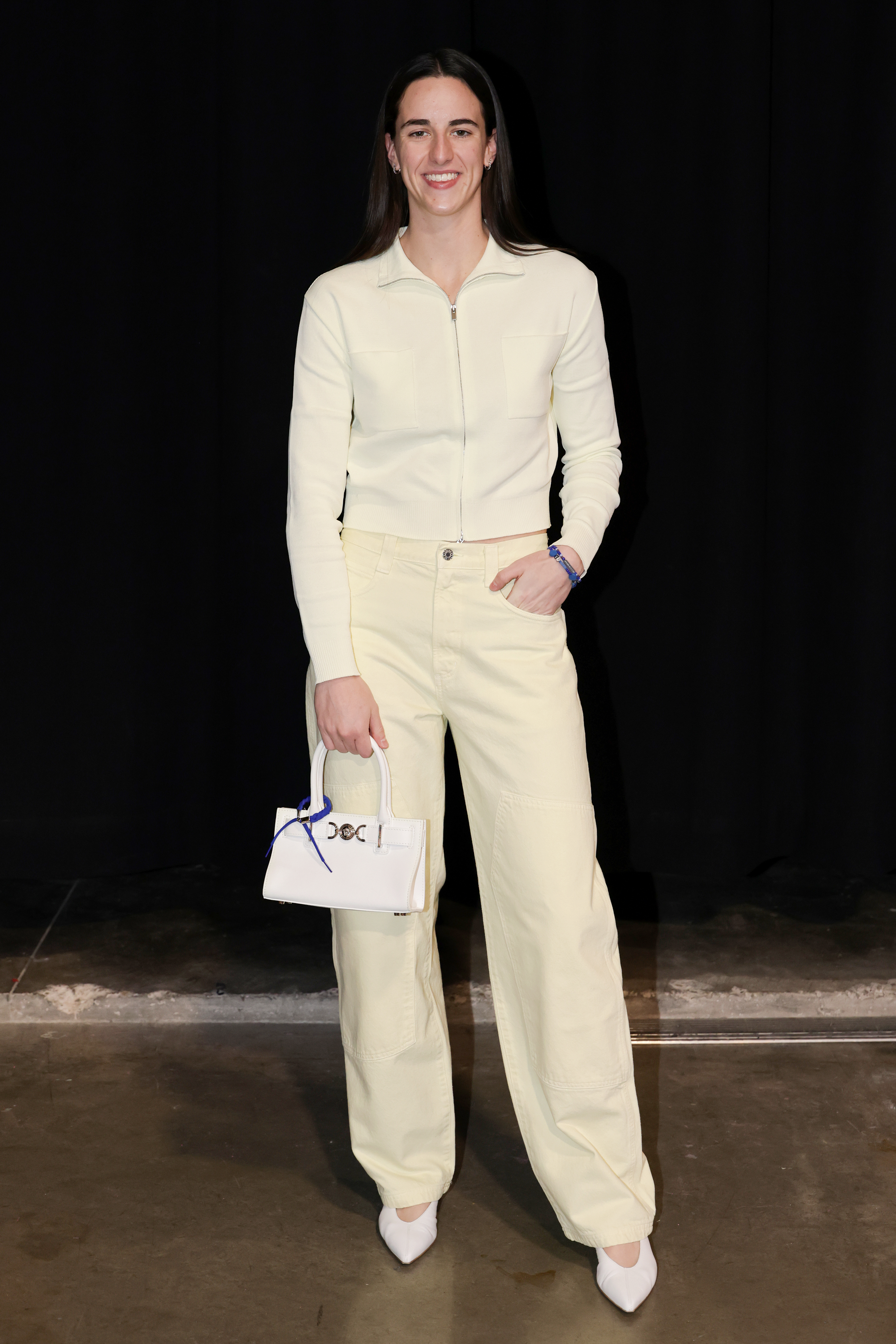 Caitlin Clark styled the butter yellow color trend in her latest tunnel walk outfit