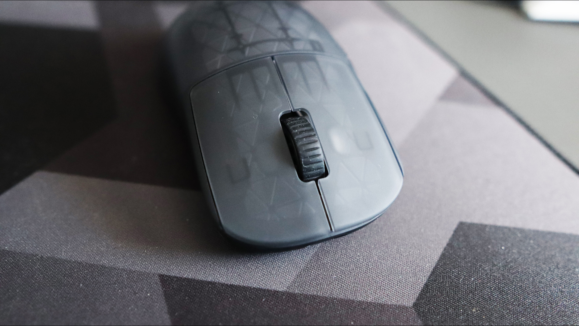 An Endgame Gear OP1w 4K gaming mouse on a desk.