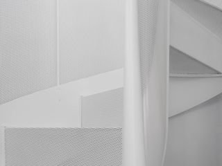 close up of minimalist white perforated metal staircase