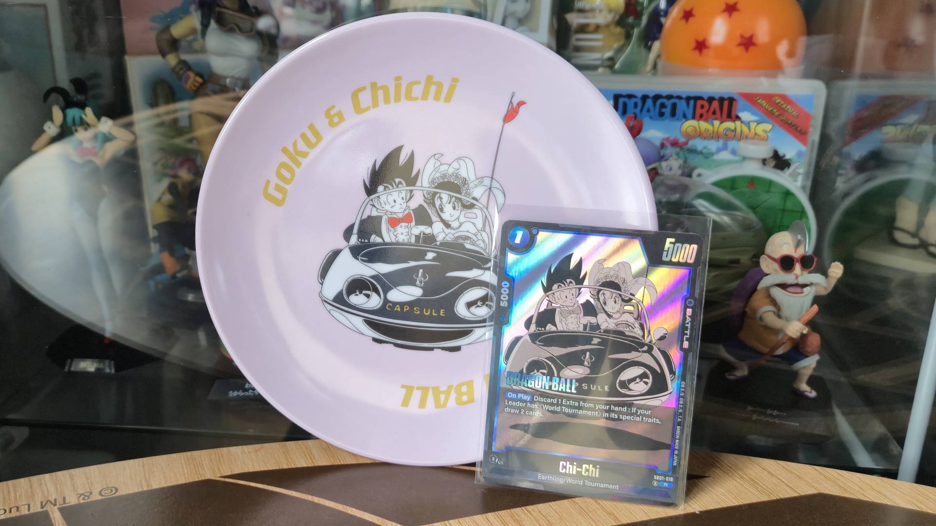 Photo by Rosalie Newcombe of the Goku and Chi Chi card from the Dragon Ball Super CG Fusion World - Manga Booster (SB01) box.