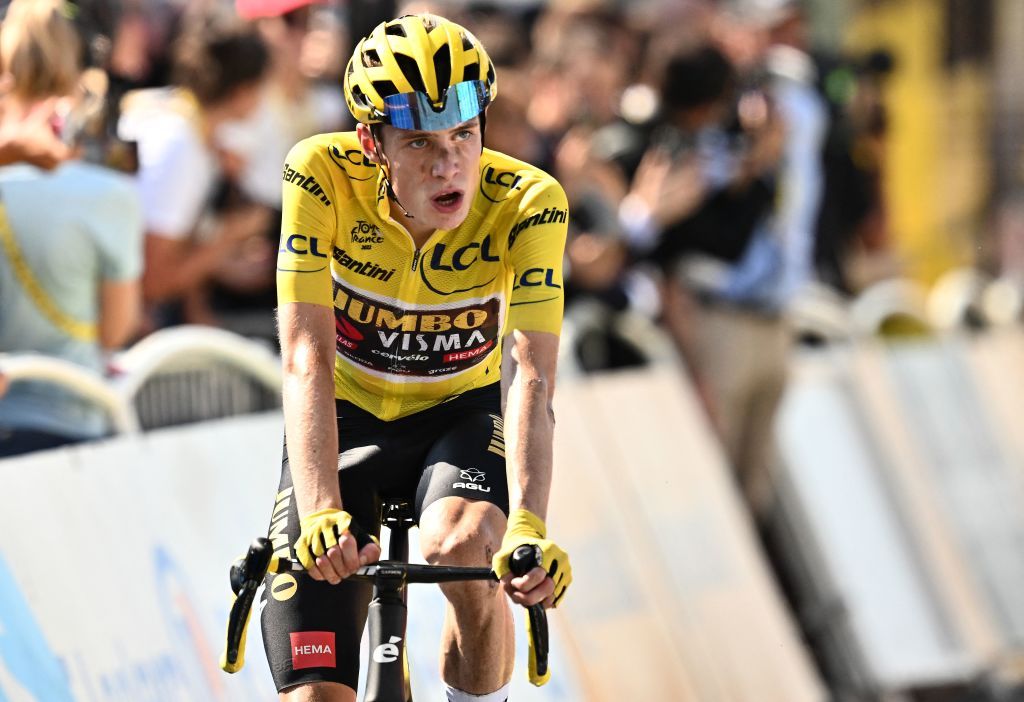 JumboVisma teams Danish rider Jonas Vingegaard wearing the overall leaders yellow jersey reacts as he cycles to the finish line to win the 18th stage of the 109th edition of the Tour de France cycling race 1432 km between Lourdes and Hautacam in the Pyrenees mountains in southwestern France on July 21 2022 Photo by Marco BERTORELLO AFP Photo by MARCO BERTORELLOAFP via Getty Images