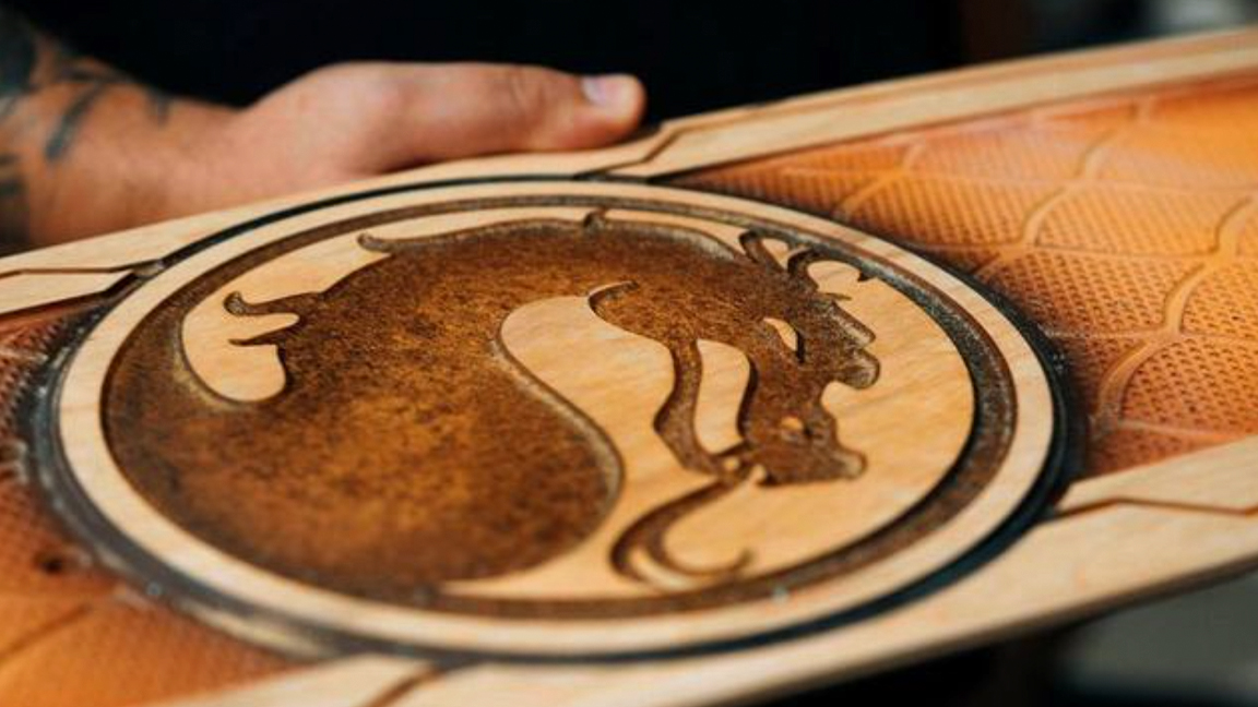 Bear Walker; a mortal kombat logo on a skateboard