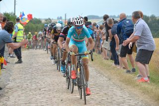 Vincenzo Nibali leads the peloton over the cobbles.
