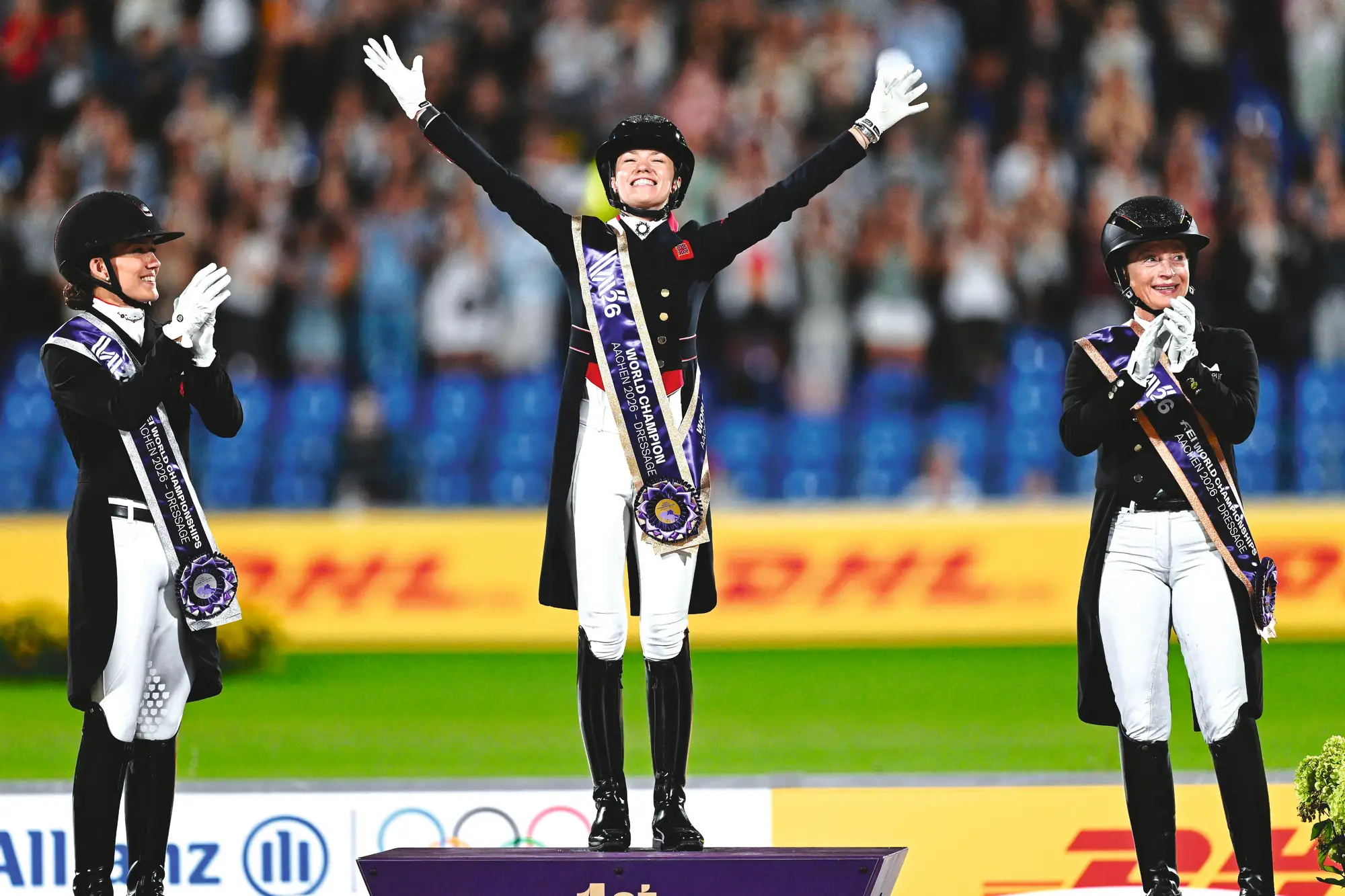 Lottie Fry on the podium at the world championships with Isabell Werth (right) and Cathrine Laudrup-Dufour (left)
