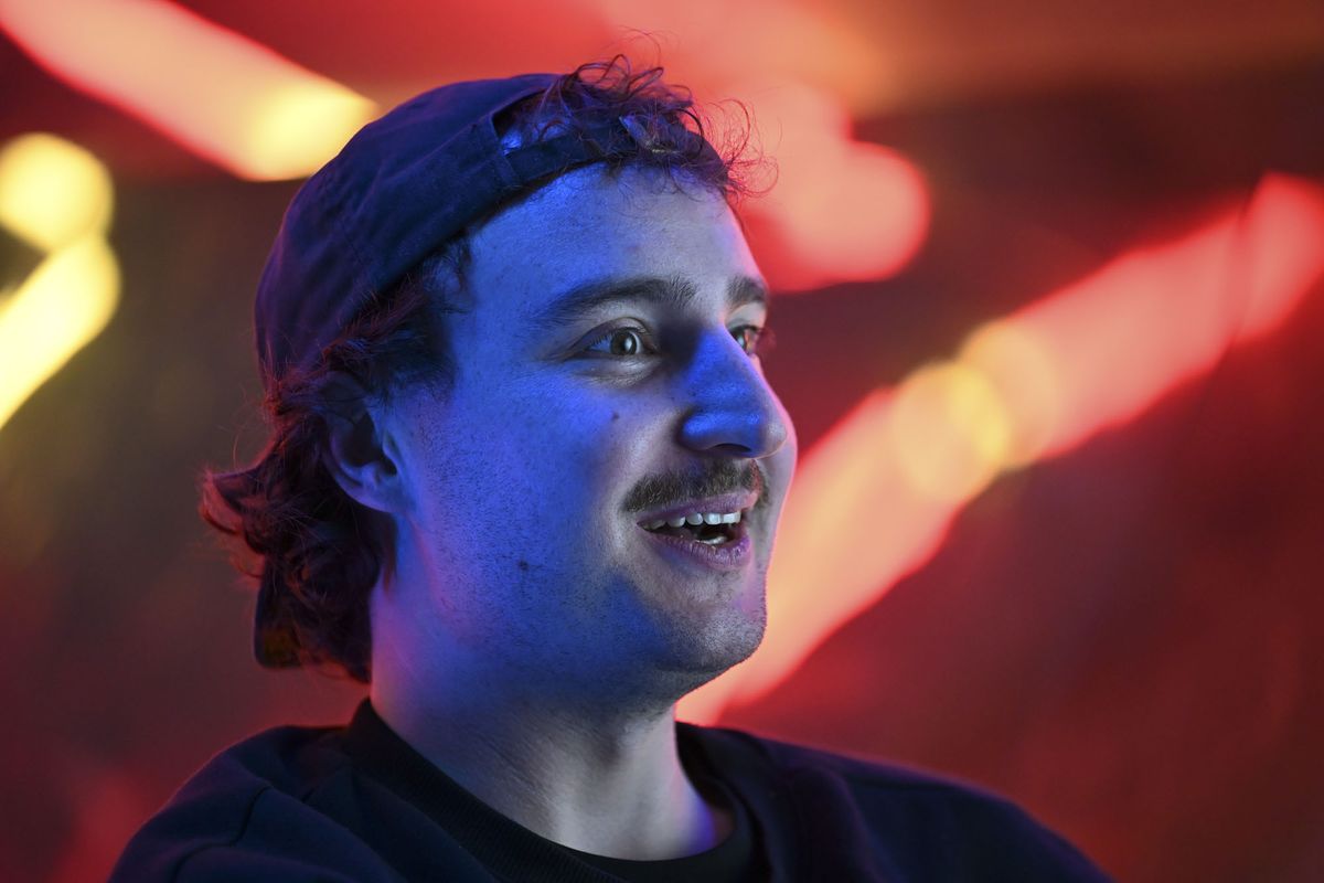 Nikon ZR sample images &ndash; man seated infront of neon lit wall