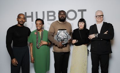 Hublot Design Prize 2022 winner Nifemi Marcus Bello holding trophy
