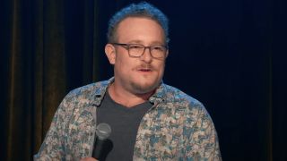 Screenshot of James Adomian telling joke during stand-up act in James Adomian: Path of Most Resistance