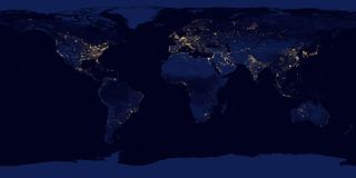 This composite image shows a global view of Earth at night, compiled from over 400 satellite images.