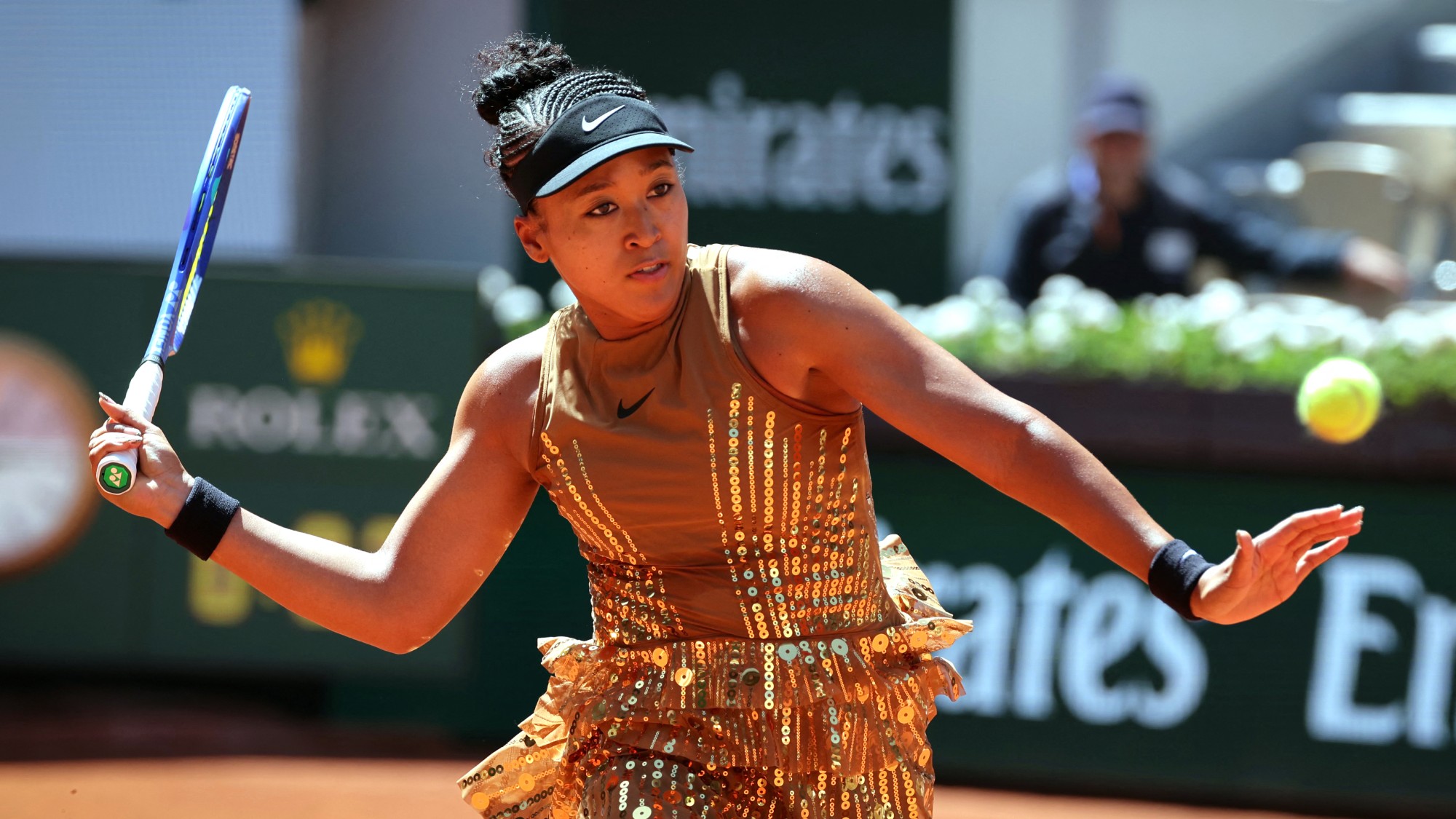 Naomi Osaka plays a forehand return to Germany's Laura Siegemund 