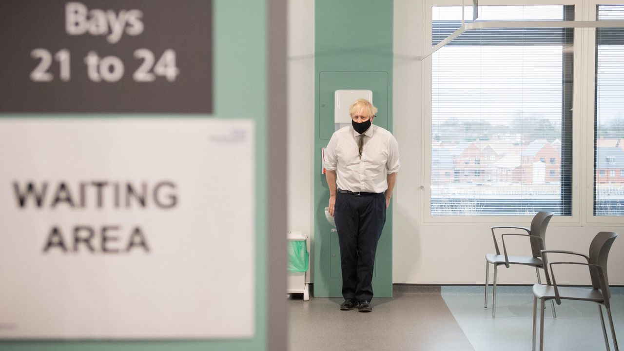 Boris Johnson during a visit to view the vaccination programme at Chase Farm Hospital.