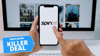 Hand pointing to phone with Spintel logo