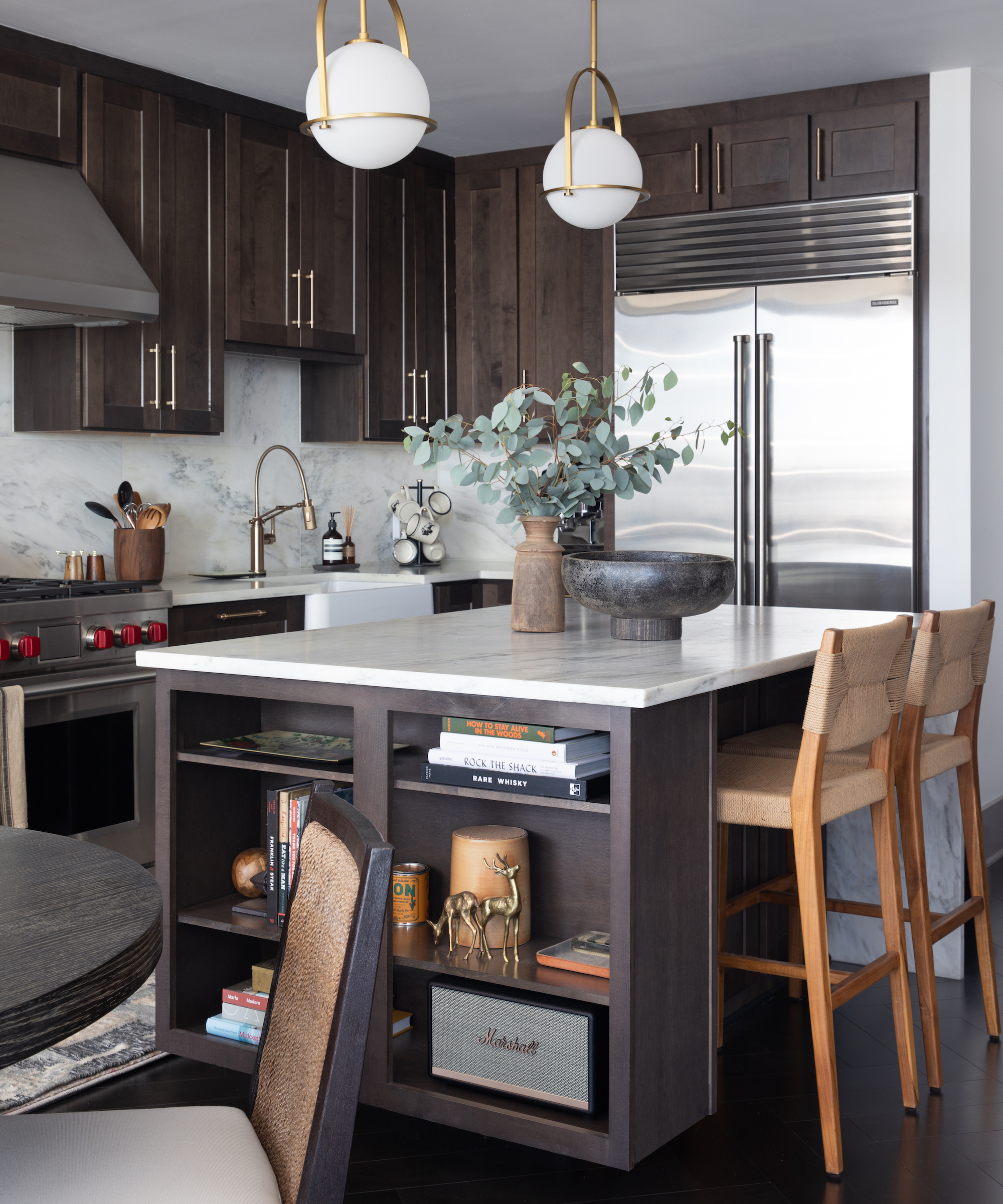dark kitchen with island and two stools