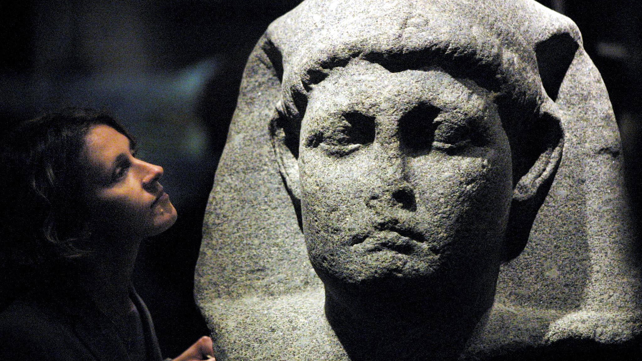 Sally-Ann Ashton admires one of the statues of Cleopatra at the launch of an exhibition at the British Museum in London in 2001.