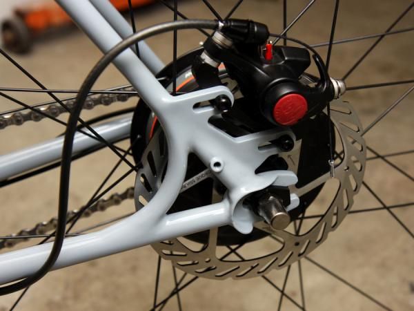Simple slotted dropouts and brake mounts are included in this True Fabrication townie bike.