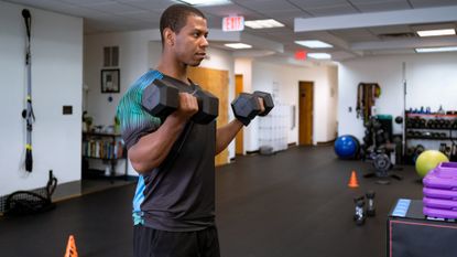 A man performing a dumbbell curl