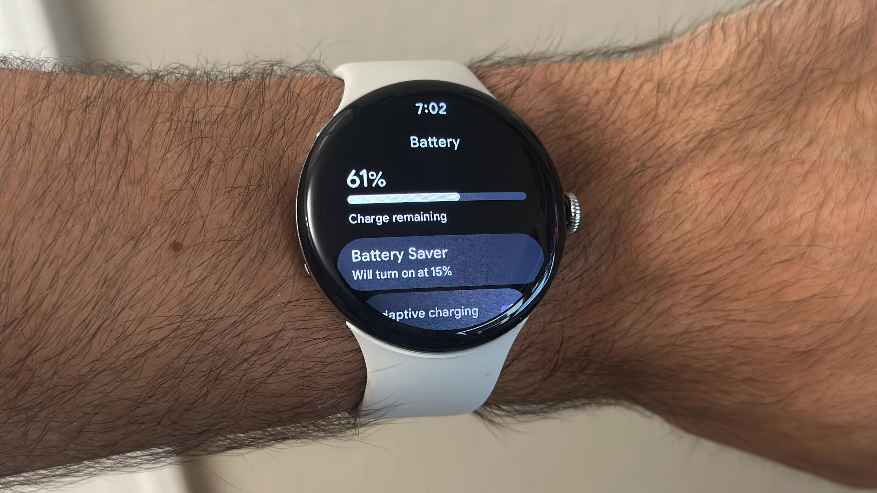 A photo of the Google Pixel Watch 4's Battery settings menu, with charge remaining and options for Battery Saver and Adaptive Charging.